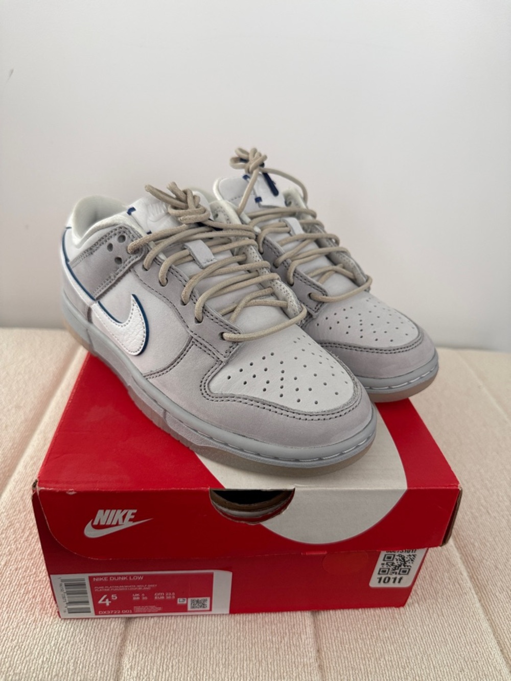 Nike Men’s Dunk Low Low-Top Sneakers in Light Gray with White Swoosh